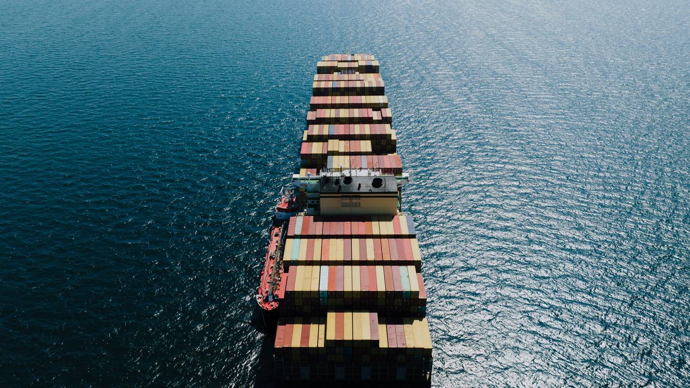 Aerial view of a fully loaded container ship under way at sea