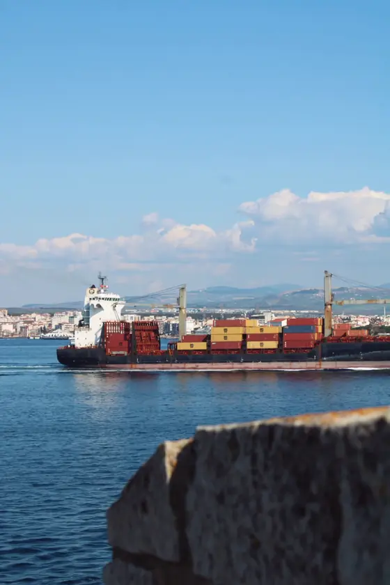 Container ship approaching port — marine supply